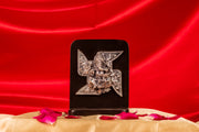 Pure silver Swastik symbol with Ganesh Ji design from Rasava Jewels, crafted in 999 pure silver, displayed on a neutral background.
